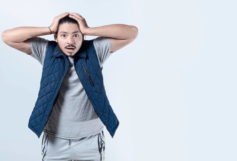 Shocked man clutching his head in excitement