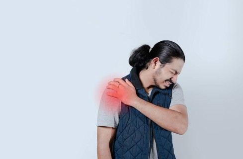 Man with shoulder pain highlighted in red. Shoulder pain concept on isolated background