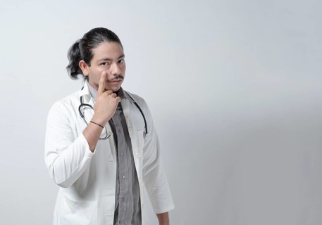 Suspicious doctor watching you on isolated