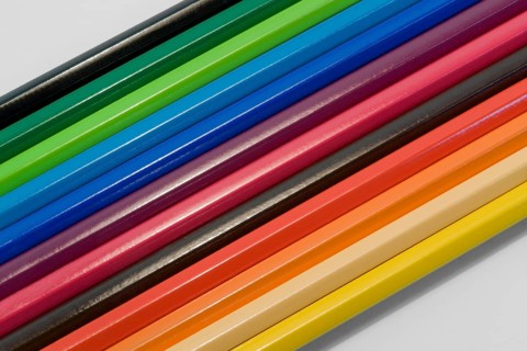Detail shot of some colored pencils in light back