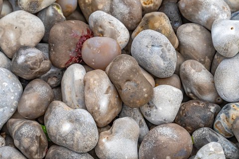 Full frame picture showing lots of cobbles seen at the Normandy region in France