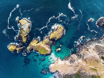 Top Down view over Kynance Cove from a drone, Mount's Bay, Lizard Point, Cornwall, England, United