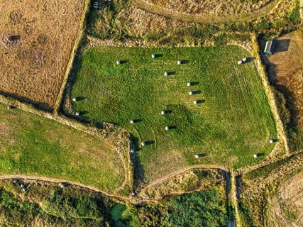 Top Down view over Cornwall fields and farms from a drone, Lizard Peninsula, South West Coast Path,