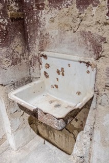 Old dilapidated washbasin in the Ohrbeck labour education camp, Hasbergen, Lower Saxony, Germany