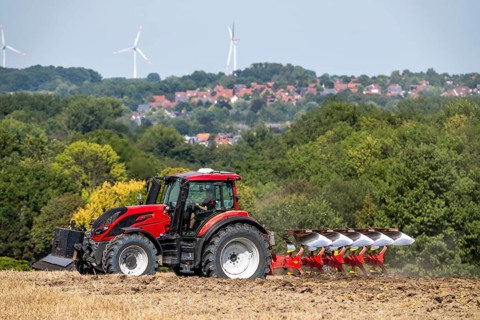 Tractor ploughs up a harvested grain field, south of Billerbeck in Münsterland, North