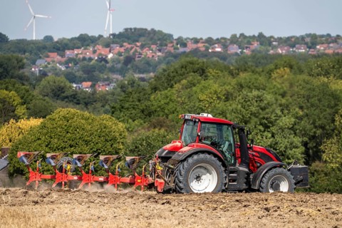 Tractor ploughs up a harvested grain field, south of Billerbeck in Münsterland, North