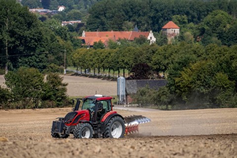 Tractor ploughs up a harvested grain field, south of Billerbeck in Münsterland, North
