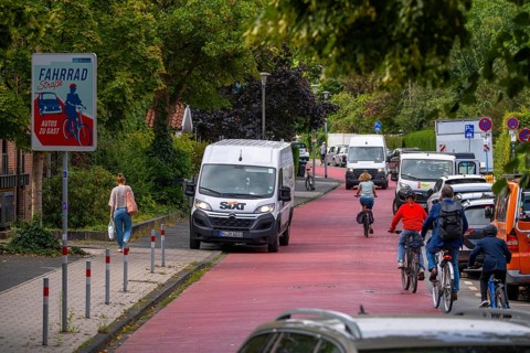 Cycling in Münster, cycle lane, Goldstraße, red asphalt and pictograms indicate to motorists that