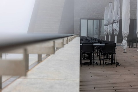 Modern Restaurant Terrace with Railing in the Clouds in a Cloudy Day in Monte Generoso, Ticino,