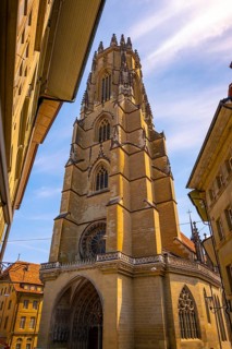 Cathedral Entrance Door and with Tower in Old Town Medieval in a Sunny Summer Day in Fribourg,