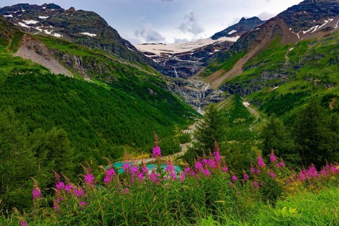 Beautiful Mountain Alp Grüm with Glacier and Alpine Lake Palü in the Swiss Alps in a Cloudy Sunny