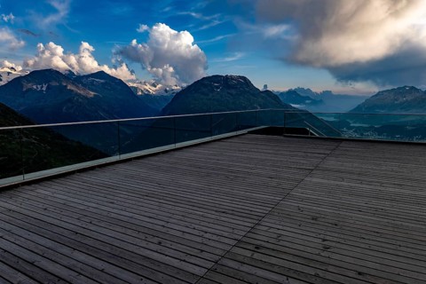 Beautiful Terrace View with Snow and over Alpine Lake and Swiss Alps and Cityscape in a Sunny Day