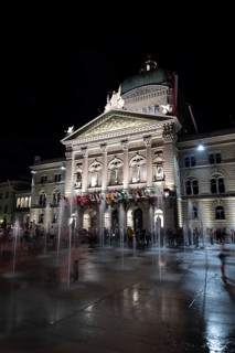 Beautiful Bundeshaus Illuminated Parliament Building or Federal Palace with Water Fountain on