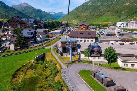 Beautiful View From Overhead Cable Car and Station and over Cityscape and Railroad Station with