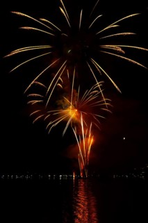Beautiful Fireworks Display at Night over Lake Lugano in Ponte Tresa, Lombardy, Italy