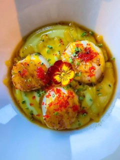 Grilled Saint-Jacques on a Mango and Passion Fruit Puree with Gorbuscha Salmon Roe Decorated with