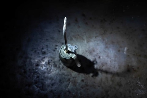 Old Dirty Oil Can with Sunlight and Shadow on a Metal Table in Mechanic Workshop in Switzerland