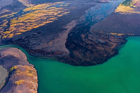 Mountain landscape, river, river delta, river course, lake, volcanic landscape, sunny, aerial view,