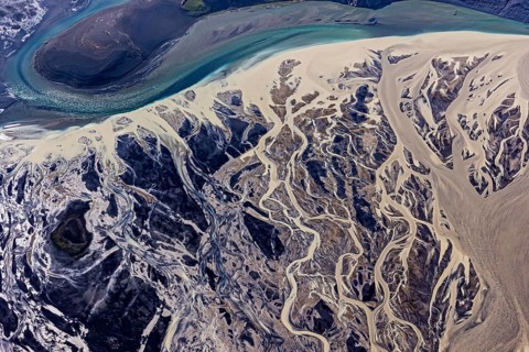Mountain landscape, river, river delta, river course, volcanic landscape, sunny, aerial view,
