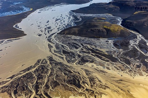 Mountain landscape, river, river delta, river course, volcanic landscape, sunny, aerial view,