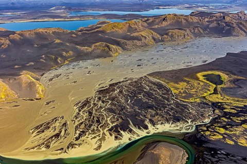 Mountain landscape, river, river delta, river course, volcanic landscape, sunny, aerial view,