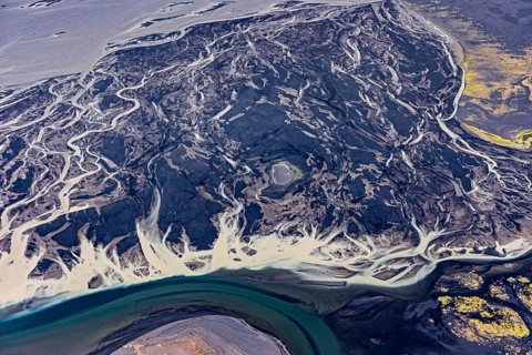 Mountain landscape, river, river delta, river course, volcanic landscape, sunny, aerial view,