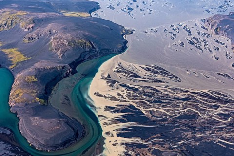 Mountain landscape, river, river delta, river course, volcanic landscape, sunny, aerial view,