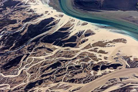 Mountain landscape, river, river delta, river course, volcanic landscape, sunny, aerial view,