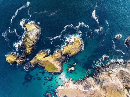 Top Down view over Kynance Cove from a drone, Mount's Bay, Lizard Point, Cornwall, England, United