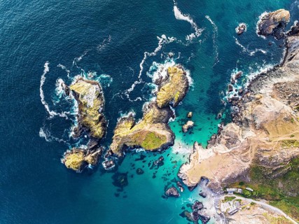 Top Down view over Kynance Cove from a drone, Mount's Bay, Lizard Point, Cornwall, England, United