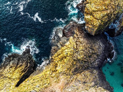 Top Down view over Kynance Cove from a drone, Mount's Bay, Lizard Point, Cornwall, England, United