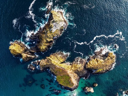 Top Down view over Kynance Cove from a drone, Mount's Bay, Lizard Point, Cornwall, England, United