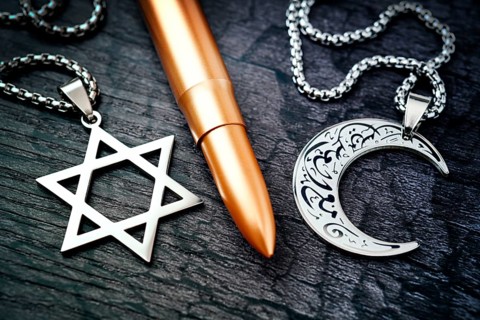 Rifle cartridge between chains with Star of David and crescent, symbolic photo Middle East and Gaza