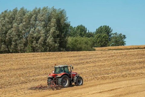 Autumn harrowing with tractor in Borrie, Ystad municipality, Skåne county, Sweden, Scandinavia