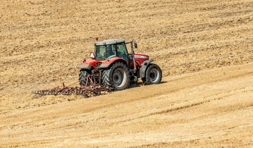 Autumn harrowing with tractor in Borrie, Ystad municipality, Skåne county, Sweden, Scandinavia
