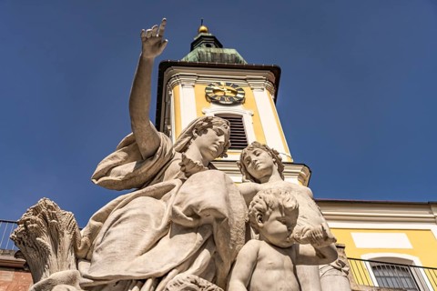 Group of figures of Mother Baar and the Catholic Church of St John in Donaueschingen,