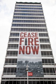 Appeal for peace and ceasefire, poster on a tower block, Dublin, Ireland