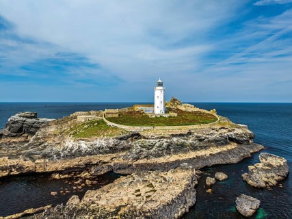 Godrevy Lighthouse from a drone, Godrevy Island, St Ives Bay, Cornwall, England, United Kingdom