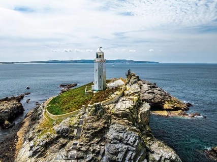 Godrevy Lighthouse from a drone, Godrevy Island, St Ives Bay, Cornwall, England, United Kingdom