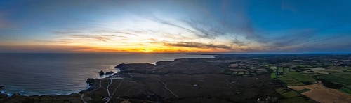 Sunset over Kynance Cove from a drone, Mount's Bay, Lizard Point, Cornwall, England, United Kingdom
