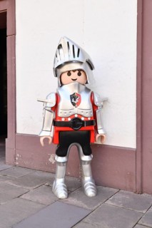 Ettlingen, Germany - August 13th 2025: Large Playmobil knight toy figurine displayed in street