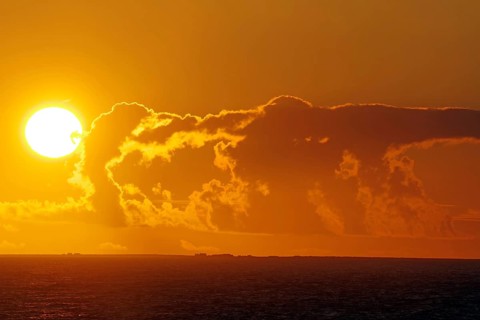 Dramatic sunset over the sea with glowing cloud formations, Orkney Islands, Scotland, Great Britain