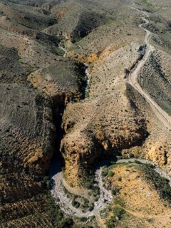 Bird's eye view of a hilly, dry landscape with recognisable paths, aerial view, Angel's Canyon,