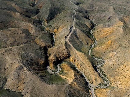 Aerial view of winding hills with a winding road through rocky landscape, aerial view, Angel's
