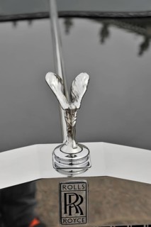 Close-up of the iconic Rolls-Royce emblem on the radiator, Retro Classics meets Baroque,