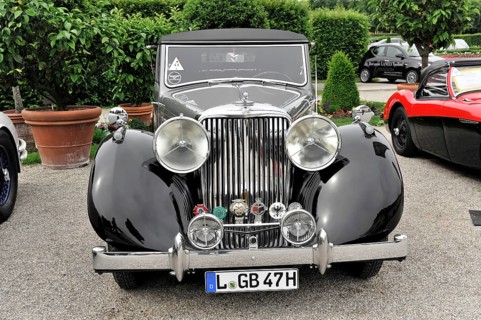 Jaguar MK IV, Oldtimer, Black vintage car with classic round headlights on display at a car
