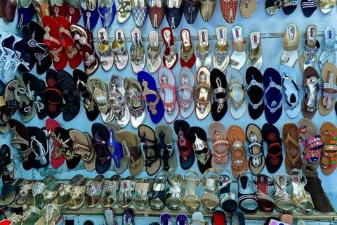 Udaipur, Rajasthan, North India, Asia, Collection of colourful shoes and sandals in a shop