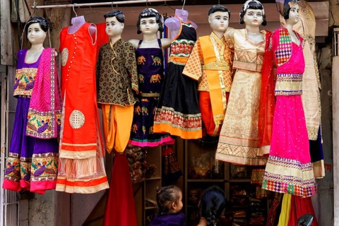 Udaipur, Rajasthan, North India, Asia, Colourful traditional dresses on mannequins in a shop
