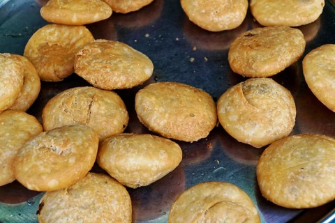Udaipur, Rajasthan, North India, Asia, Kachori, a golden-brown and crispy snack, lies ready on a