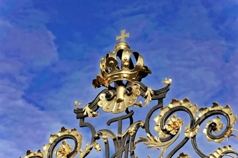 Prague, Czech Republic, Europe, Detailed decorated Tor tor with golden crown and cross in front of